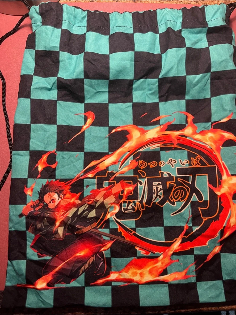 Teal & Black Checkered Drawstring Bag with Fiery Graphic